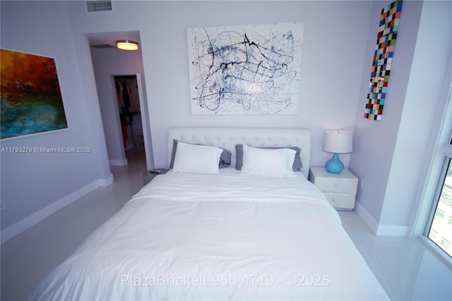 950 Brickell Bay Dr Unit 4710, Miami, FL 33131 - bedroom with baseboards and visible vents