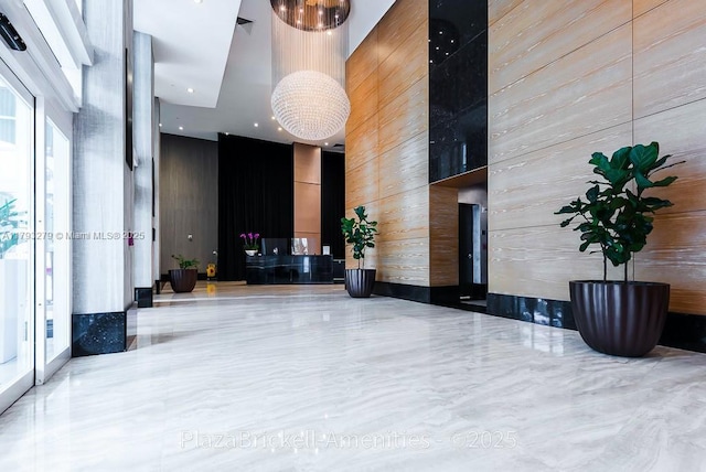 950 Brickell Bay Dr Unit 4710, Miami, FL 33131 - lobby featuring a towering ceiling and wood walls