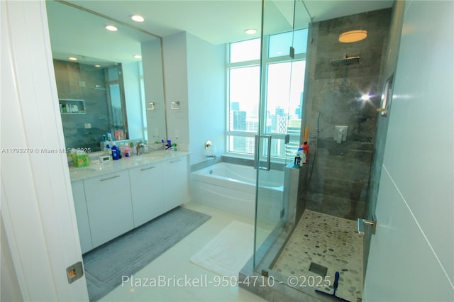 950 Brickell Bay Dr Unit 4710, Miami, FL 33131 - full bathroom featuring double vanity, recessed lighting, a shower stall, and a bath
