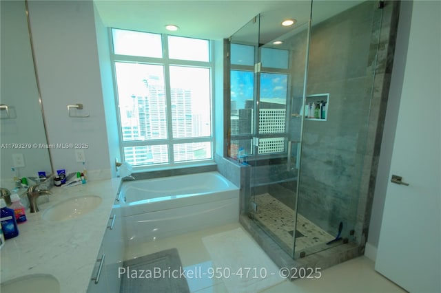 950 Brickell Bay Dr Unit 4710, Miami, FL 33131 - bathroom with a sink, double vanity, a city view, a garden tub, and a stall shower