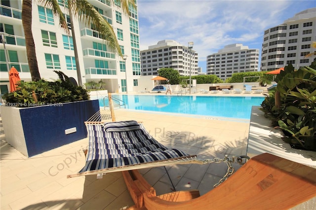 950 Brickell Bay Dr Unit 4710, Miami, FL 33131 - community pool with a city view and a patio