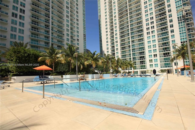 950 Brickell Bay Dr Unit 4710, Miami, FL 33131 - community pool featuring a patio