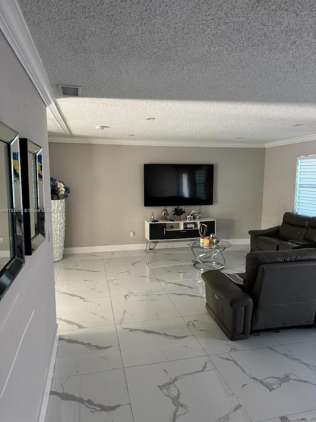 living area featuring visible vents, ornamental molding, marble finish floor, baseboards, and a textured ceiling