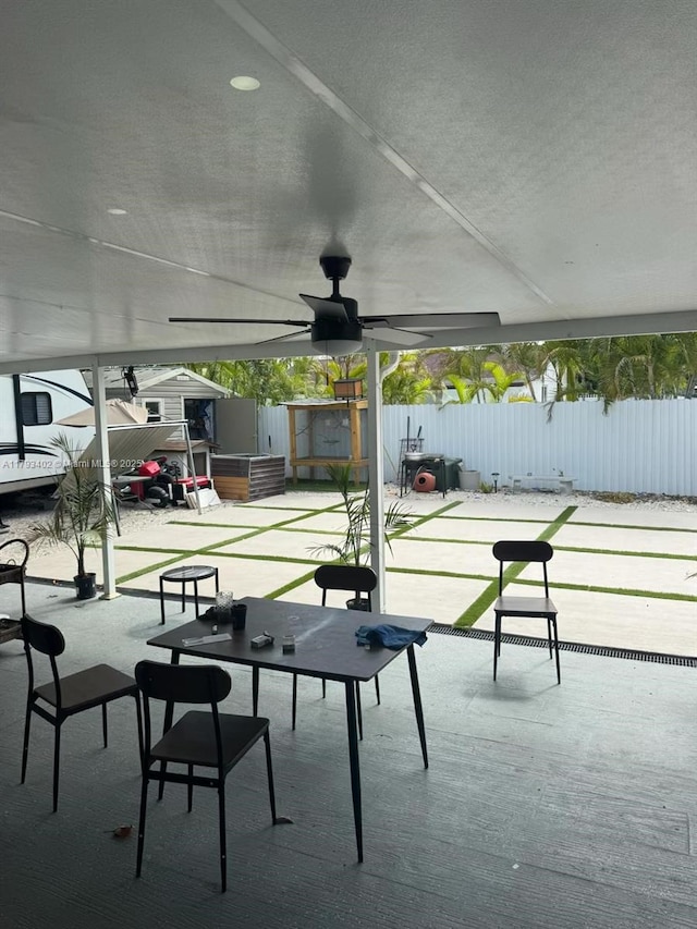 surrounding community featuring fence and a patio