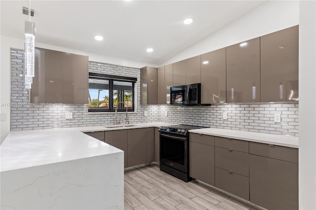 kitchen featuring range with electric stovetop, a sink, gray cabinets, and modern cabinets
