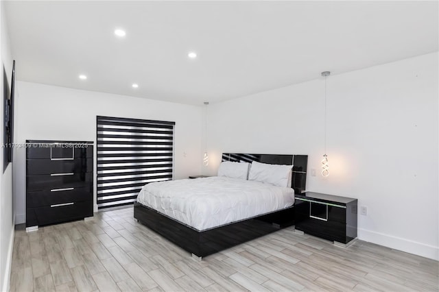 bedroom featuring recessed lighting, light wood-style flooring, and baseboards