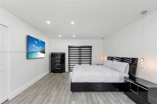 bedroom featuring recessed lighting, baseboards, and light wood-type flooring