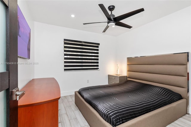 bedroom featuring recessed lighting, baseboards, a ceiling fan, and light wood-type flooring
