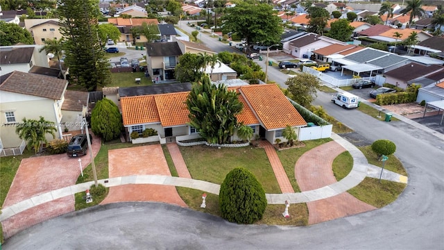 birds eye view of property with a residential view
