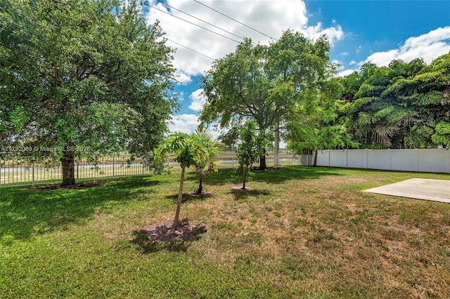 view of yard featuring a patio area and fence