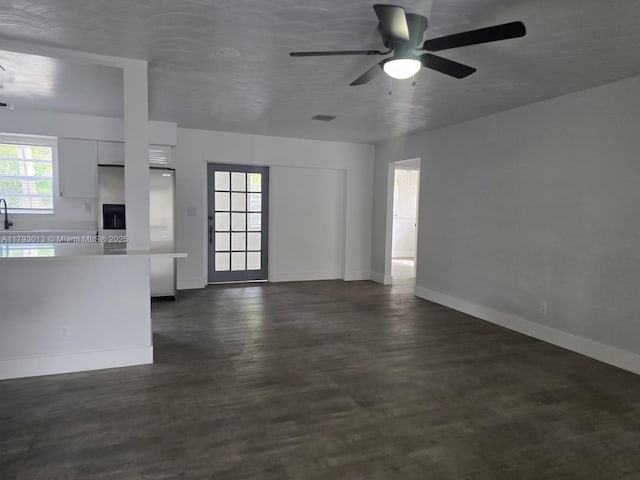 3801 NW 8th Ct, Lauderhill, FL 33311 - unfurnished living room featuring baseboards, a ceiling fan, dark wood finished floors, and visible vents