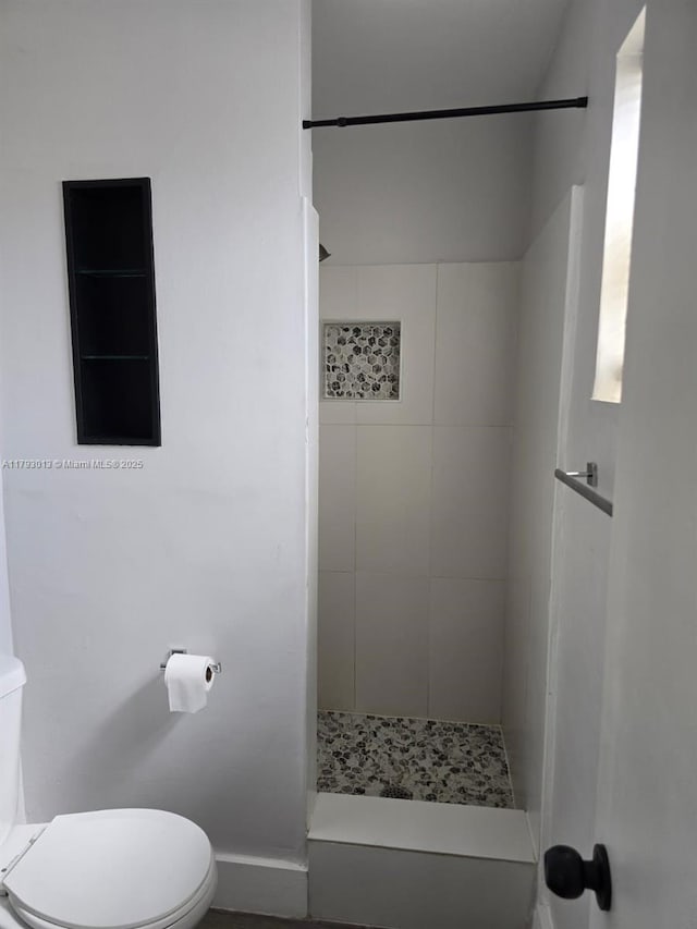 3801 NW 8th Ct, Lauderhill, FL 33311 - bathroom with baseboards, toilet, and a shower stall