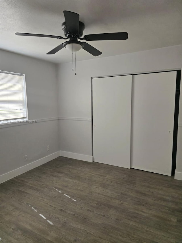 3801 NW 8th Ct, Lauderhill, FL 33311 - unfurnished bedroom featuring baseboards, wood finished floors, and a closet