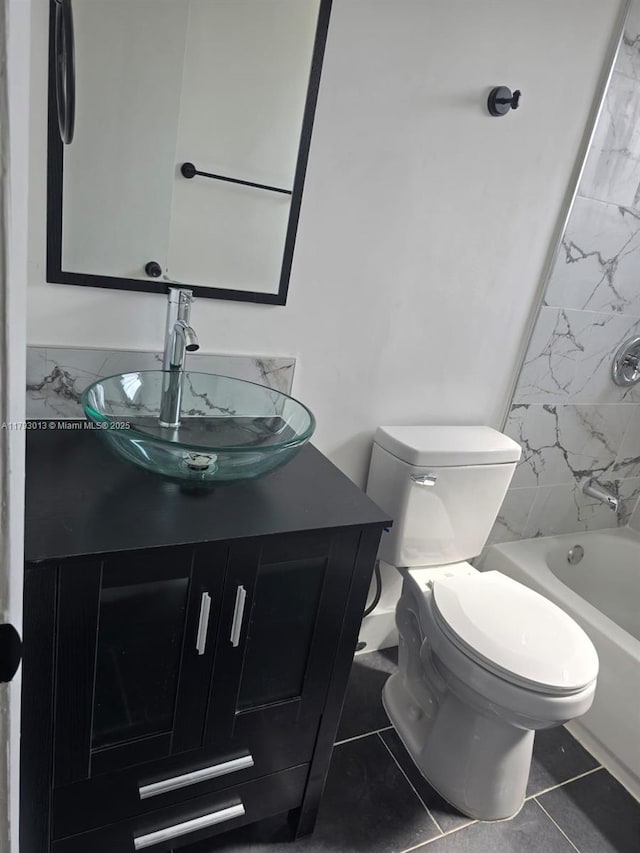 3801 NW 8th Ct, Lauderhill, FL 33311 - bathroom featuring toilet, tile patterned floors, washtub / shower combination, and vanity