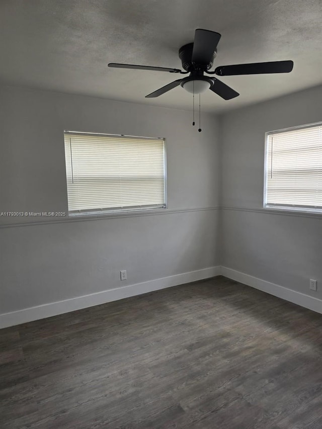 3801 NW 8th Ct, Lauderhill, FL 33311 - spare room with baseboards, dark wood finished floors, and a wealth of natural light