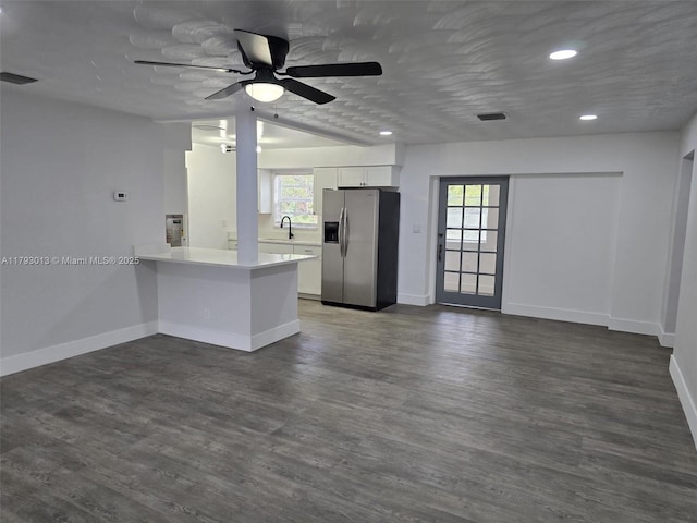 3801 NW 8th Ct, Lauderhill, FL 33311 - kitchen with stainless steel fridge, a sink, a ceiling fan, white cabinetry, and visible vents