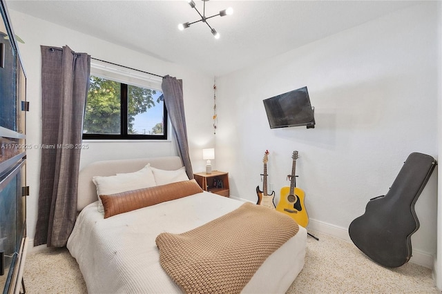bedroom featuring baseboards, a notable chandelier, and speckled floor