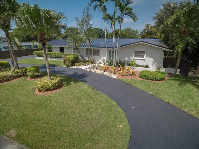14520 SW 79th Ct, Palmetto Bay, FL 33158 - single story home featuring stucco siding, a front lawn, a metal roof, and a standing seam roof