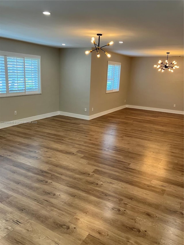14520 SW 79th Ct, Palmetto Bay, FL 33158 - spare room featuring a chandelier, wood finished floors, and recessed lighting