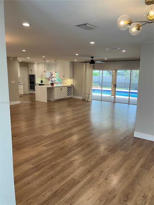 14520 SW 79th Ct, Palmetto Bay, FL 33158 - unfurnished living room featuring recessed lighting and dark wood-style floors