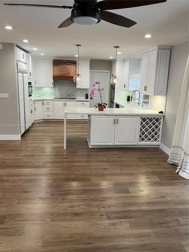 14520 SW 79th Ct, Palmetto Bay, FL 33158 - kitchen with premium range hood, ceiling fan, light countertops, a peninsula, and white cabinets
