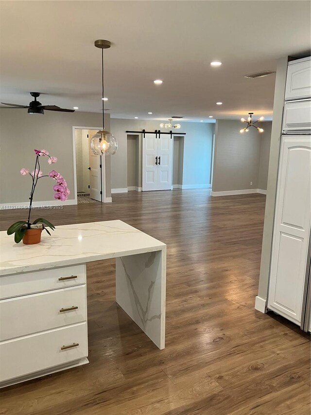 14520 SW 79th Ct, Palmetto Bay, FL 33158 - kitchen with custom exhaust hood, backsplash, white cabinets, a peninsula, and recessed lighting
