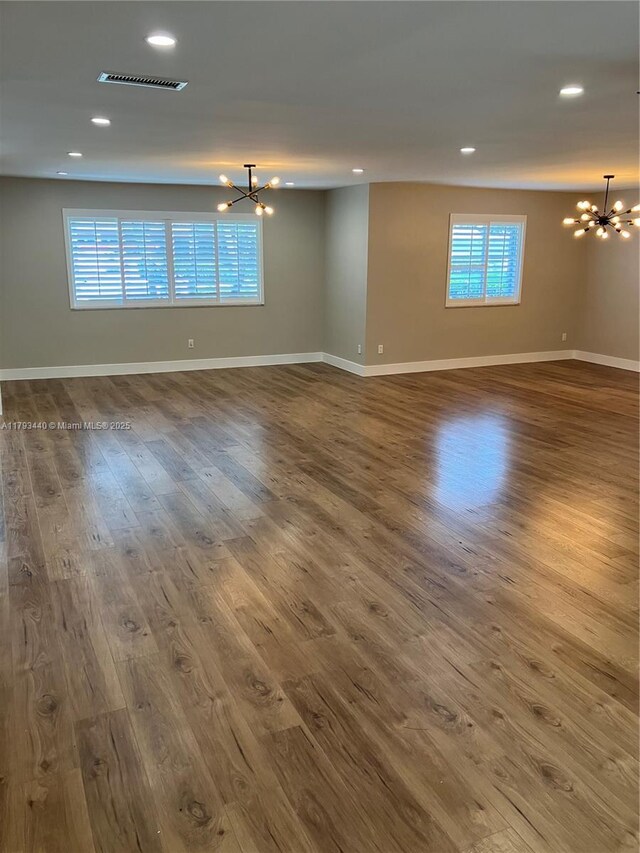 14520 SW 79th Ct, Palmetto Bay, FL 33158 - spare room with a chandelier, wood finished floors, and recessed lighting