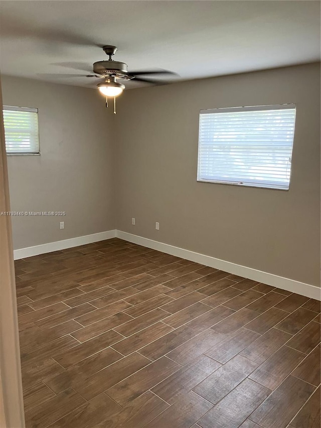 14520 SW 79th Ct, Palmetto Bay, FL 33158 - spare room with dark wood-style floors and a ceiling fan