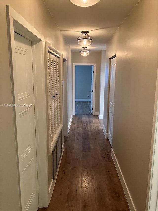 14520 SW 79th Ct, Palmetto Bay, FL 33158 - hall featuring dark wood-style flooring and baseboards