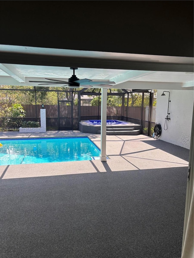 14520 SW 79th Ct, Palmetto Bay, FL 33158 - view of swimming pool with glass enclosure, a patio area, and an in-ground hot tub