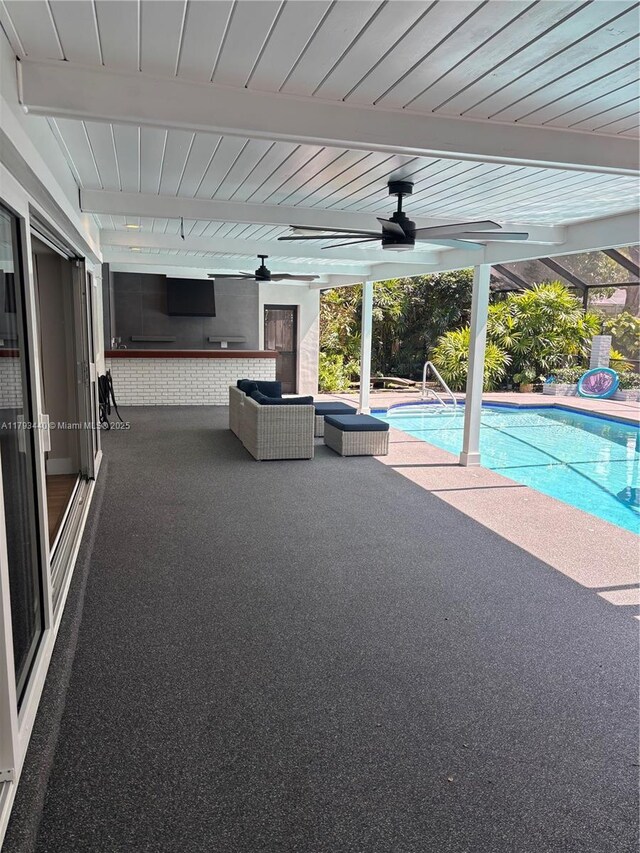 14520 SW 79th Ct, Palmetto Bay, FL 33158 - swimming pool featuring a ceiling fan, a patio, and outdoor lounge area