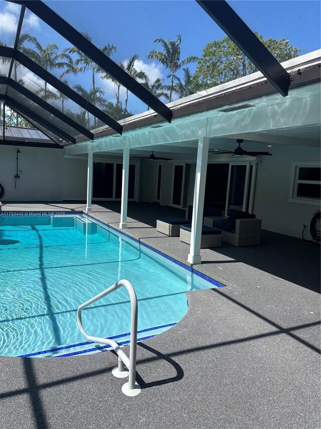 14520 SW 79th Ct, Palmetto Bay, FL 33158 - outdoor pool with ceiling fan, an outdoor living space, a patio area, and glass enclosure