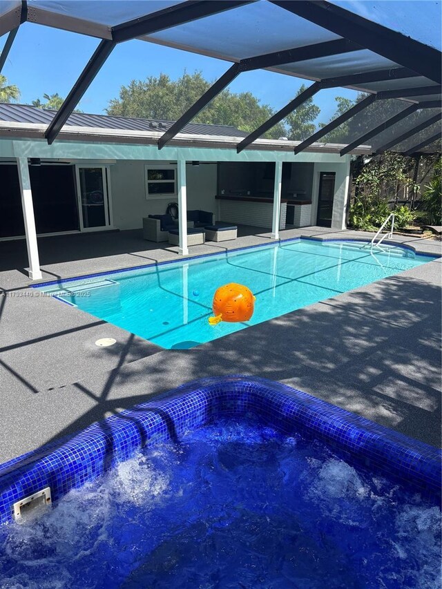 14520 SW 79th Ct, Palmetto Bay, FL 33158 - swimming pool featuring a patio, a hot tub, and glass enclosure