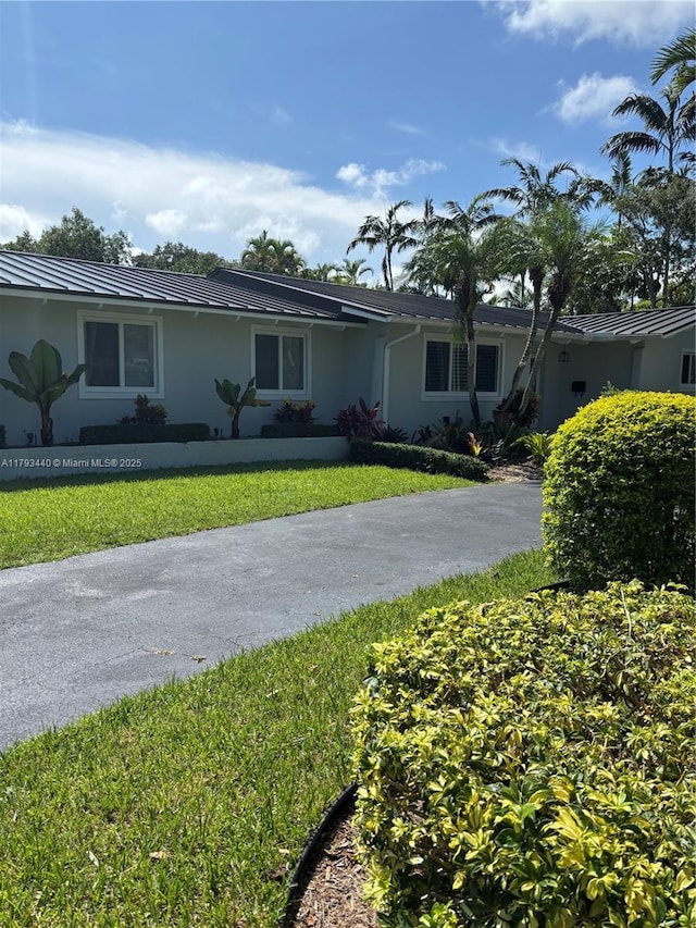14520 SW 79th Ct, Palmetto Bay, FL 33158 - ranch-style house featuring stucco siding, a front yard, and asphalt driveway