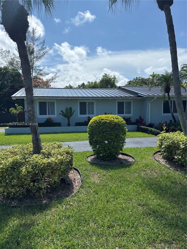 14520 SW 79th Ct, Palmetto Bay, FL 33158 - single story home featuring stucco siding, a front lawn, and a standing seam roof