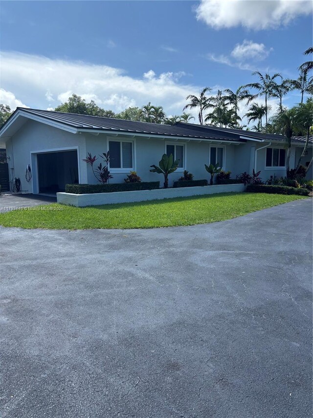 14520 SW 79th Ct, Palmetto Bay, FL 33158 - ranch-style home featuring an attached garage, asphalt driveway, stucco siding, and a front yard