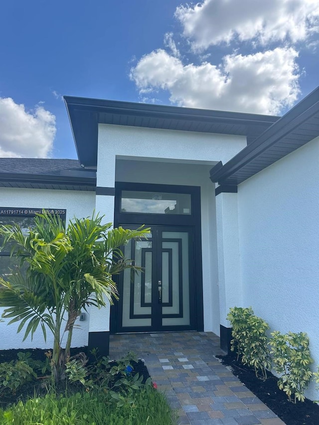 1022 Candleligth St, Lehigh Acres, FL 33974 - doorway to property featuring stucco siding