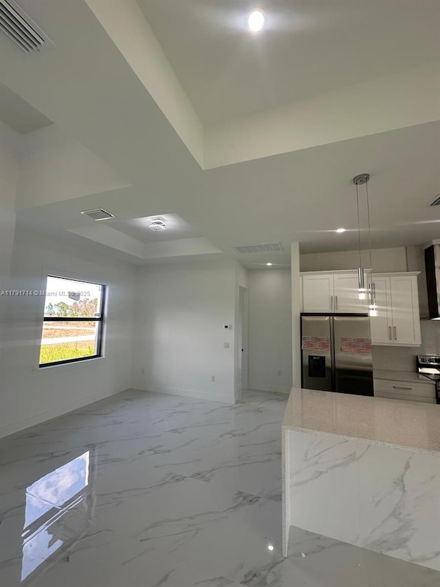 1022 Candleligth St, Lehigh Acres, FL 33974 - kitchen with stainless steel refrigerator with ice dispenser, visible vents, baseboards, recessed lighting, and white cabinetry