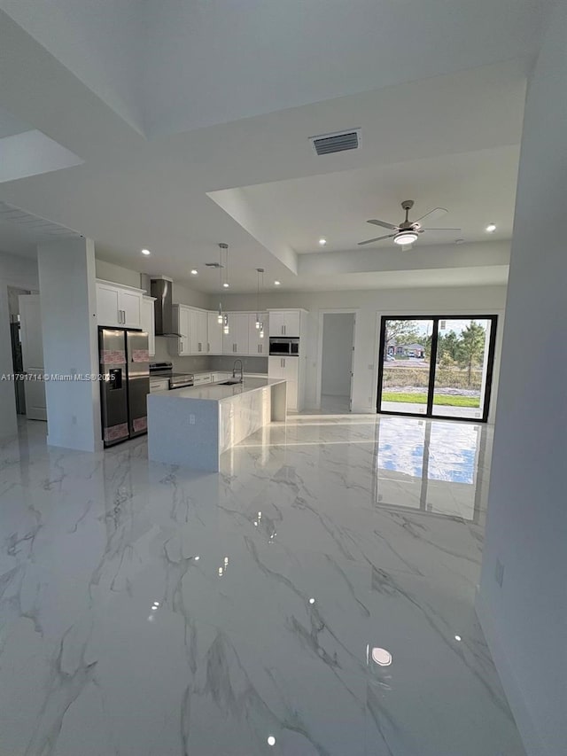 1022 Candleligth St, Lehigh Acres, FL 33974 - unfurnished living room with a sink, baseboards, recessed lighting, and visible vents