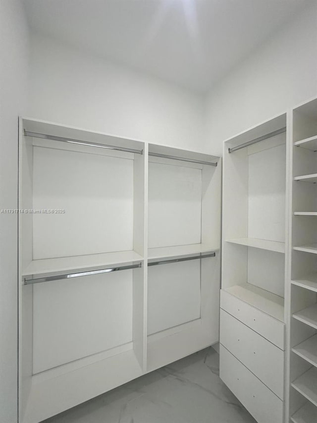 1022 Candleligth St, Lehigh Acres, FL 33974 - walk in closet featuring marble finish floor