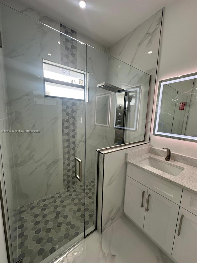 1022 Candleligth St, Lehigh Acres, FL 33974 - bathroom featuring recessed lighting, a marble finish shower, marble finish floor, and vanity