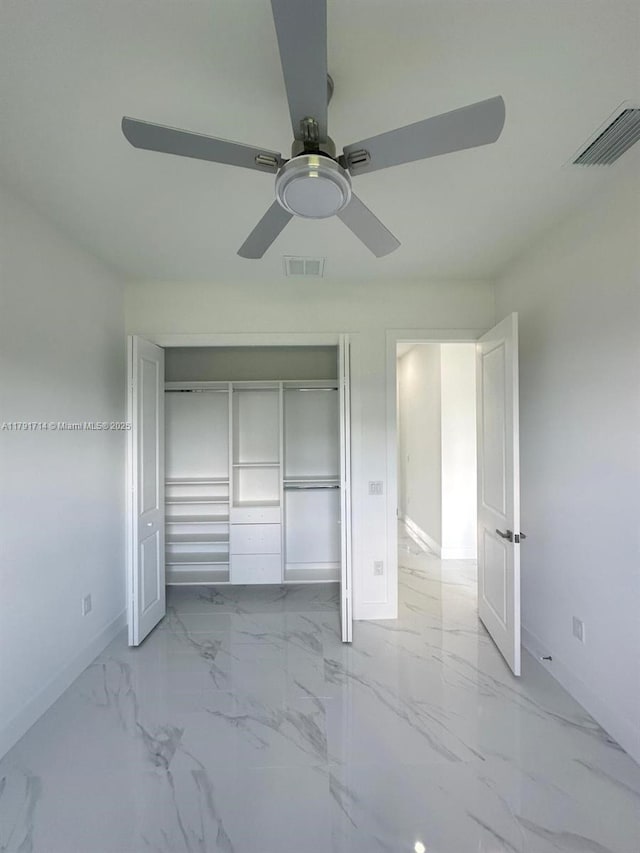 1022 Candleligth St, Lehigh Acres, FL 33974 - unfurnished bedroom featuring baseboards, visible vents, marble finish floor, and a closet