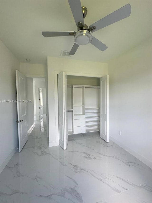 1022 Candleligth St, Lehigh Acres, FL 33974 - unfurnished bedroom featuring ceiling fan, visible vents, baseboards, a closet, and marble finish floor