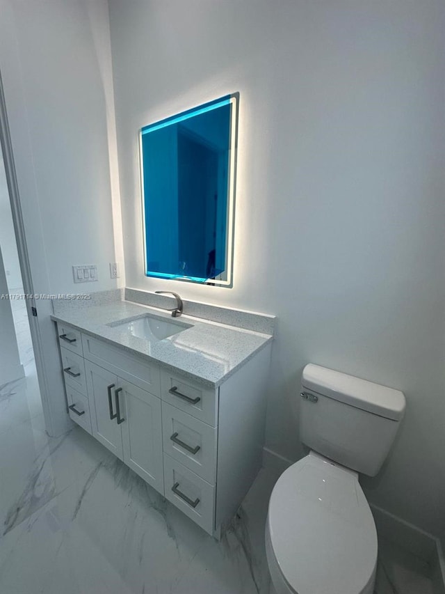 1022 Candleligth St, Lehigh Acres, FL 33974 - bathroom featuring toilet, marble finish floor, and vanity