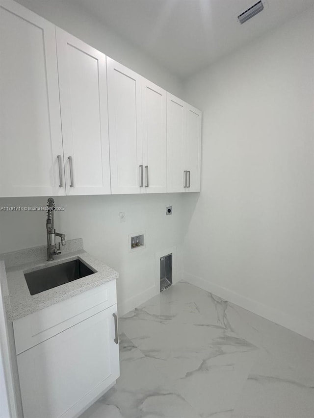 1022 Candleligth St, Lehigh Acres, FL 33974 - washroom featuring cabinet space, a sink, baseboards, hookup for an electric dryer, and visible vents