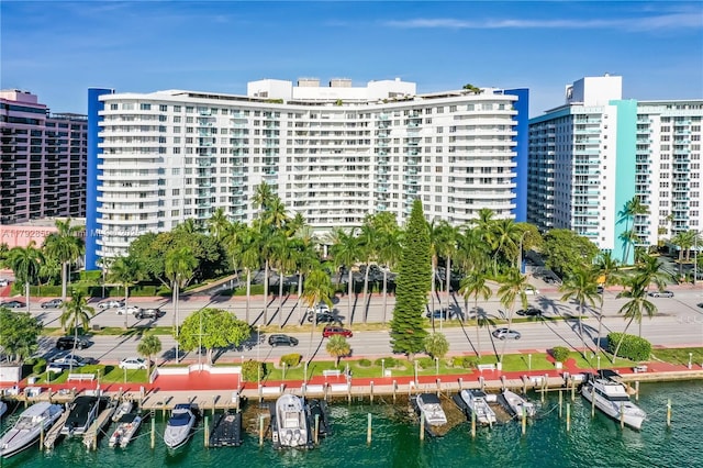 view of building exterior featuring a view of city and a water view