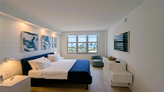bedroom with wood finished floors