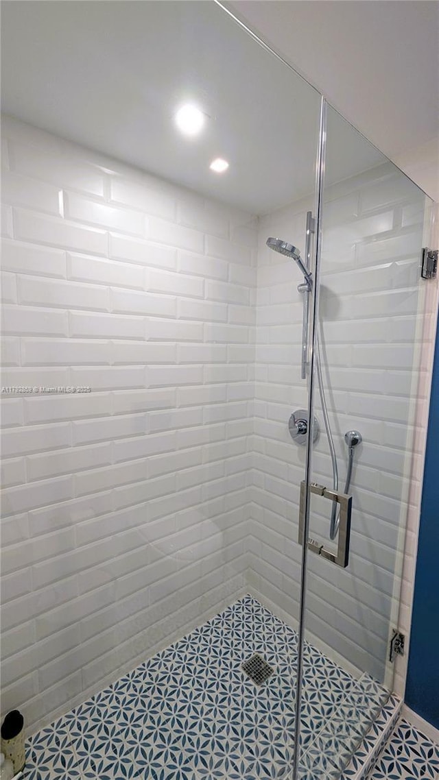 full bath with recessed lighting and a shower stall