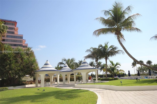 view of property's community with a gazebo and a lawn