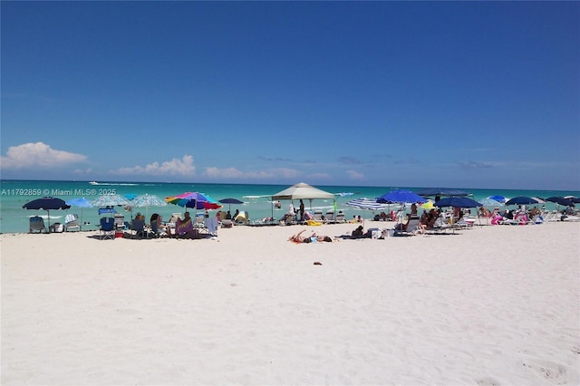 property view of water featuring a beach view